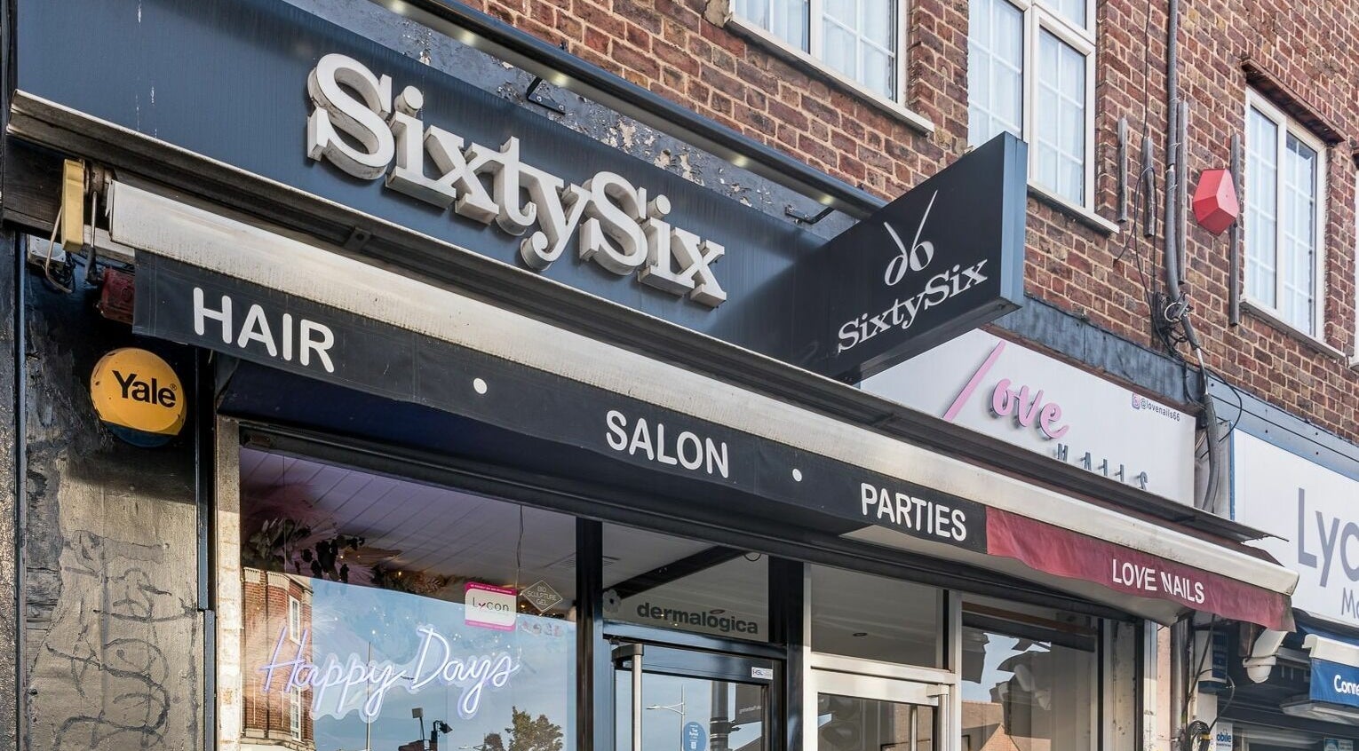 Exterior of SixtySix beauty salon in Ilford, England, GB, showcasing modern signage and attractive storefront.