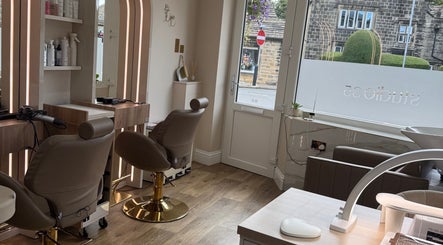 Chic interior of Studio 35 beauty salon in Baildon, England, GB with modern seating and decor.