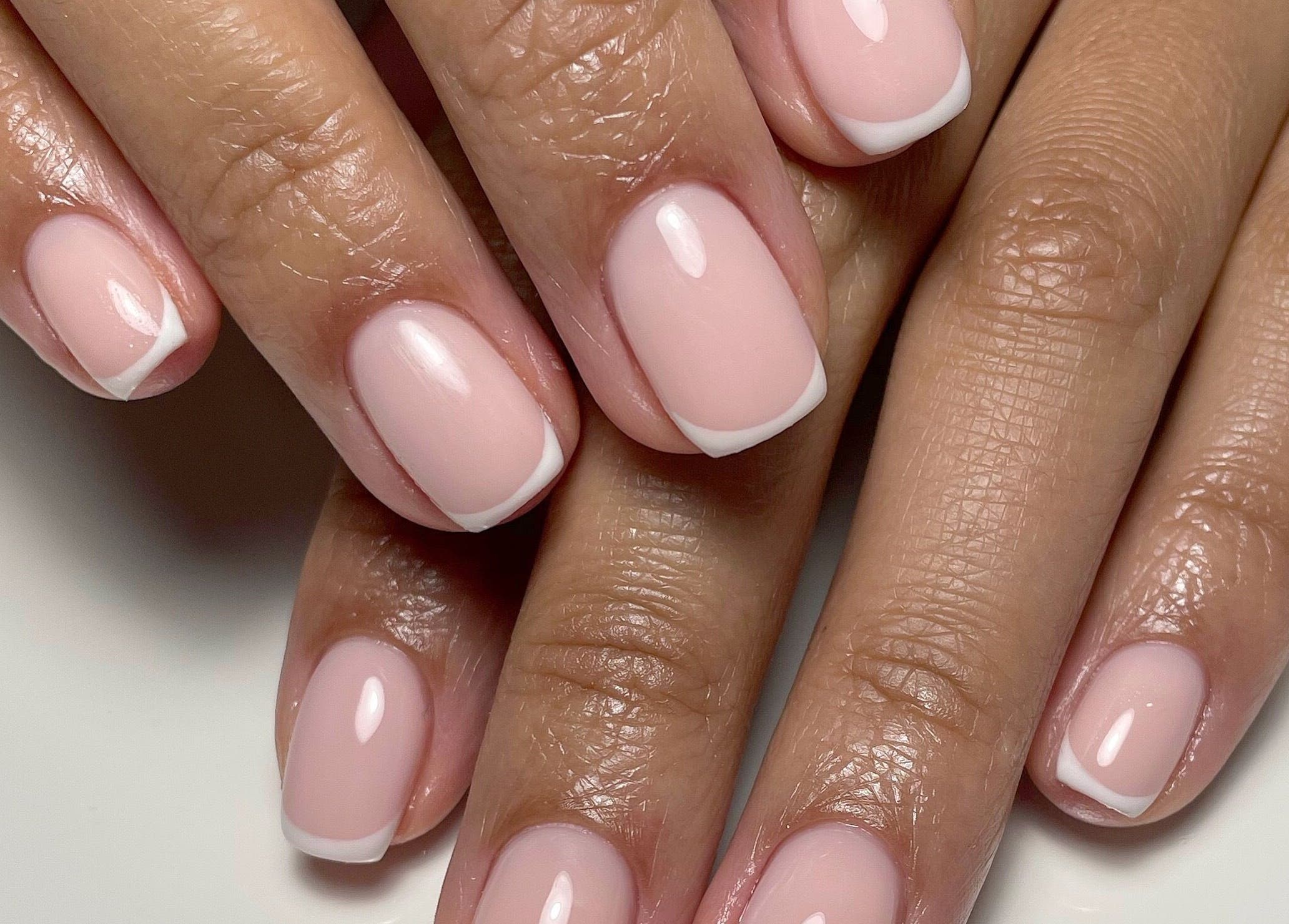 French manicure on nails at JM Nails and Beauty, Birmingham, England, GB.