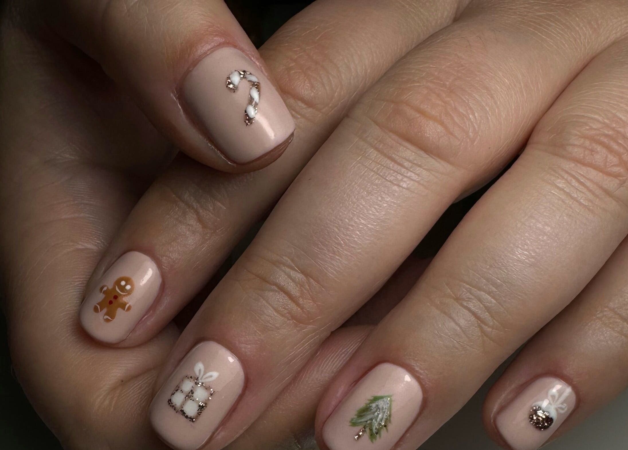 Festive nail art at JM Nails and Beauty in Birmingham, England, GB, featuring holiday designs.