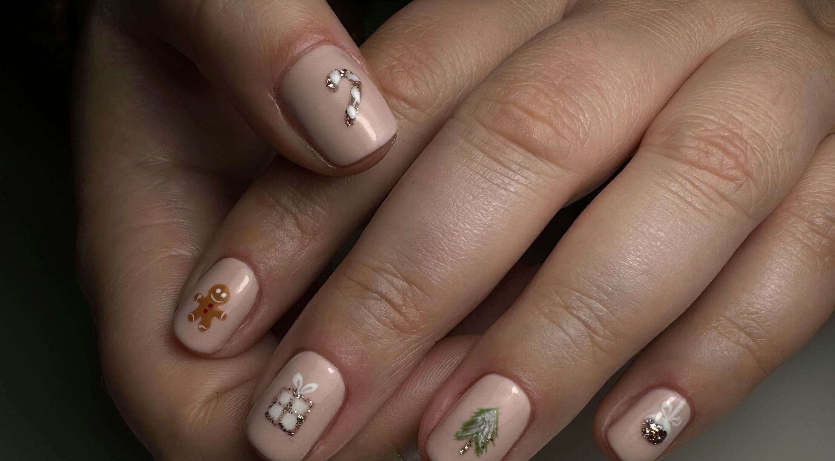 Festive nail art at JM Nails and Beauty in Birmingham, England, GB, featuring holiday designs.