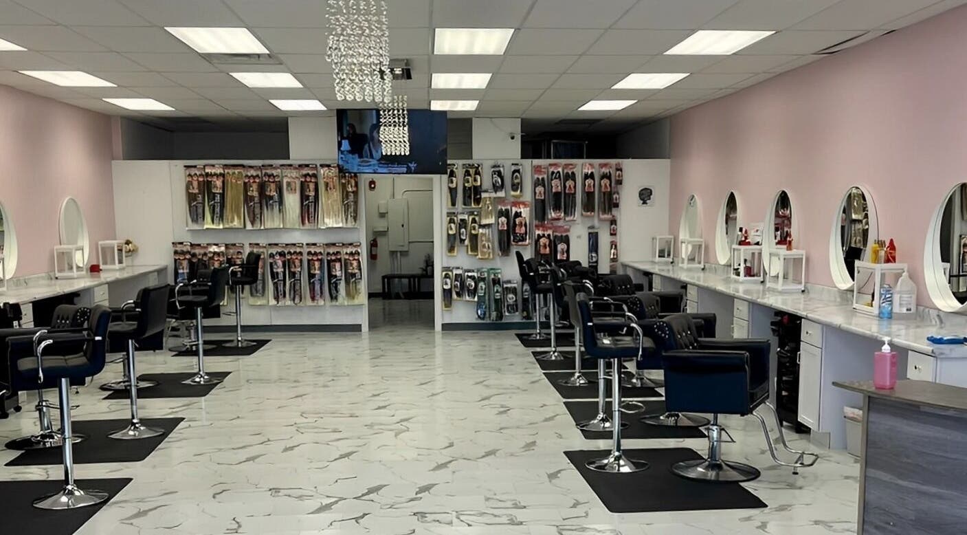 Spacious A&O Braiding salon in Woodridge, Illinois, US with stylish chairs and hair products displayed.