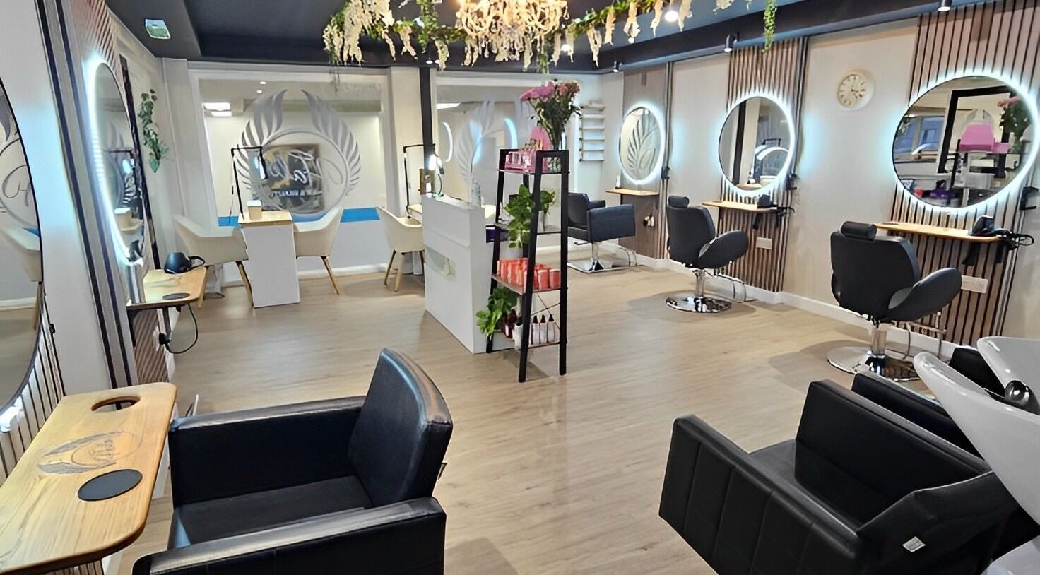 Inside view of Halo Hair & Beauty in Shetland, Scotland, GB, featuring stylish salon chairs and mirrors.