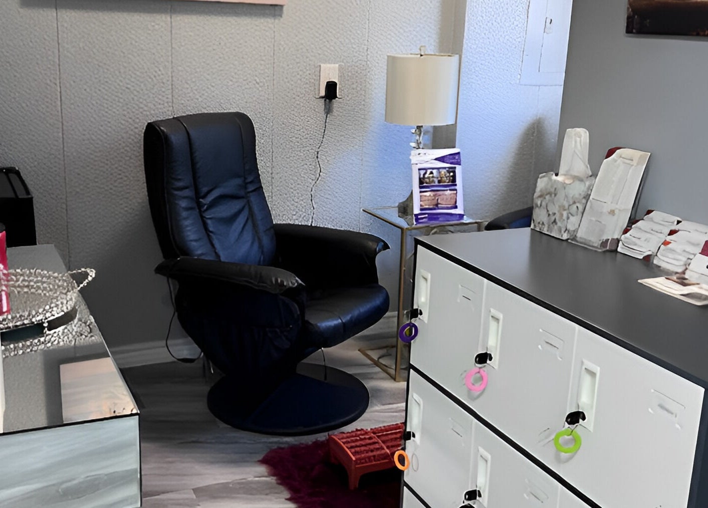 Relaxing lounge at Flawless Spa Retreat of Distinction, Live Oak, Texas, US, with cozy chair and modern decor.