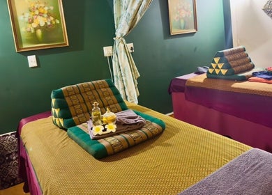 Cozy massage room at Rabeang Mai Thai Massage Therapy, Cape Town, Western Cape, ZA with vibrant decor.