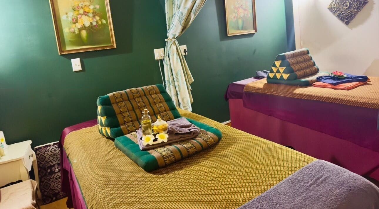 Cozy massage room at Rabeang Mai Thai Massage Therapy, Cape Town, Western Cape, ZA with vibrant decor.