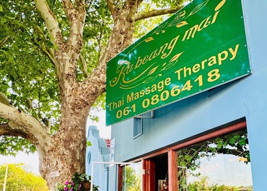 Rabeang Mai Thai Massage Therapy entrance under lush trees in Cape Town, Western Cape, ZA.