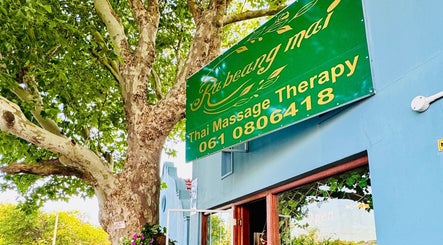 Rabeang Mai Thai Massage Therapy entrance under lush trees in Cape Town, Western Cape, ZA.
