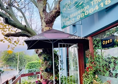 Entrance of Rabeang Mai Thai Massage Therapy in Cape Town, Western Cape, ZA with outdoor decor.