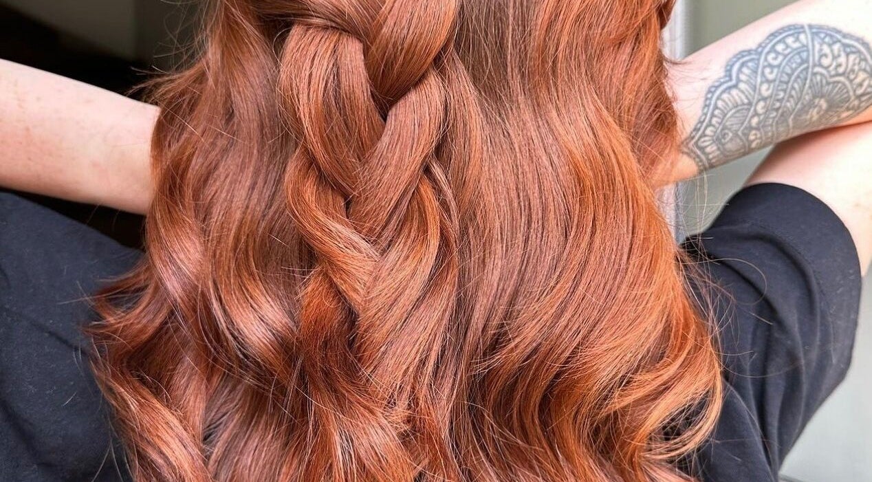 Copper braid hairstyle at Mousse Hair Studio in Guiseley, England, GB, showcasing elegant style.