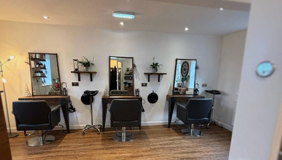 Stylish interior of Dawn Furness at Okra Salon, Bedlington, England, GB, showcasing salon chairs and mirrors.