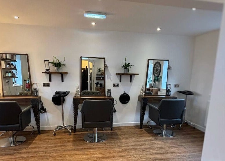Stylish interior of Dawn Furness at Okra Salon, Bedlington, England, GB, showcasing salon chairs and mirrors.
