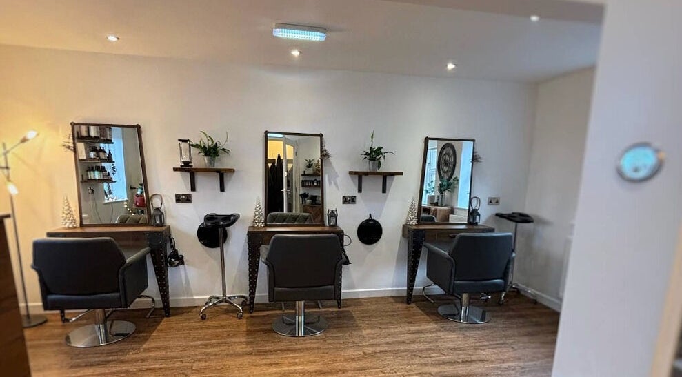 Stylish interior of Dawn Furness at Okra Salon, Bedlington, England, GB, showcasing salon chairs and mirrors.