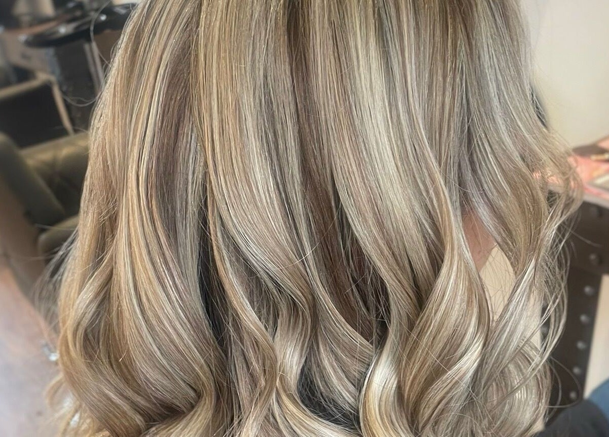 Blonde wavy hairstyle crafted by Dawn Furness at Okra Salon, Bedlington, England, GB.