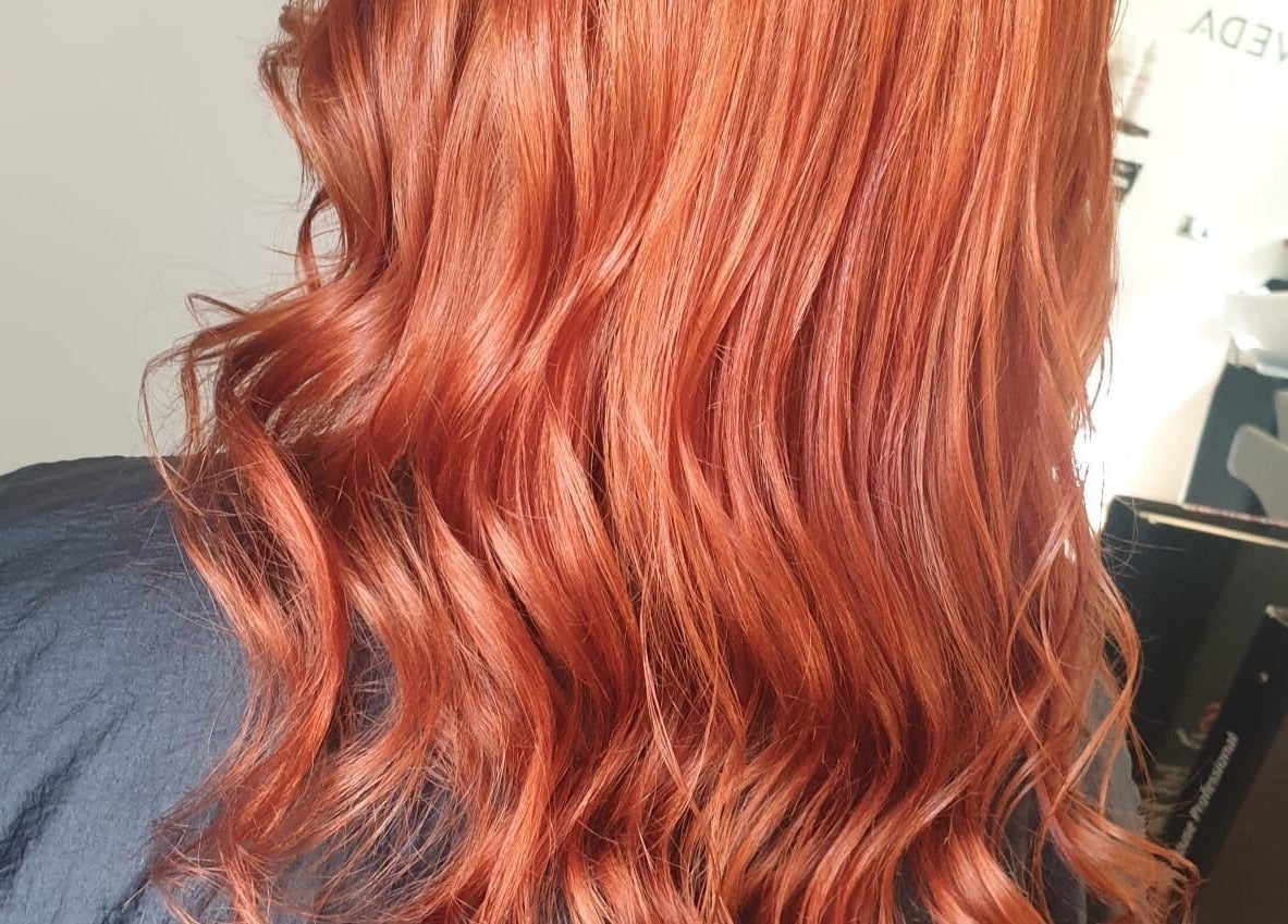 Vibrant red waves hairstyle by Dawn Furness at Okra Salon, Bedlington, England, GB.