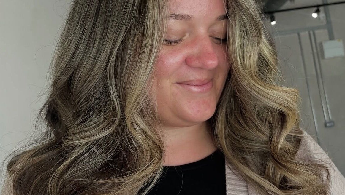 Woman with stylish curls at Chloe Jade Hair, Rogerstone, Newport, GB.