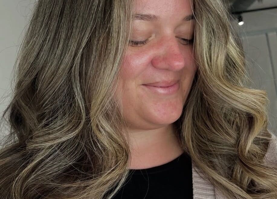 Woman with stylish curls at Chloe Jade Hair, Rogerstone, Newport, GB.