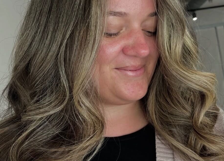 Woman with stylish curls at Chloe Jade Hair, Rogerstone, Newport, GB.