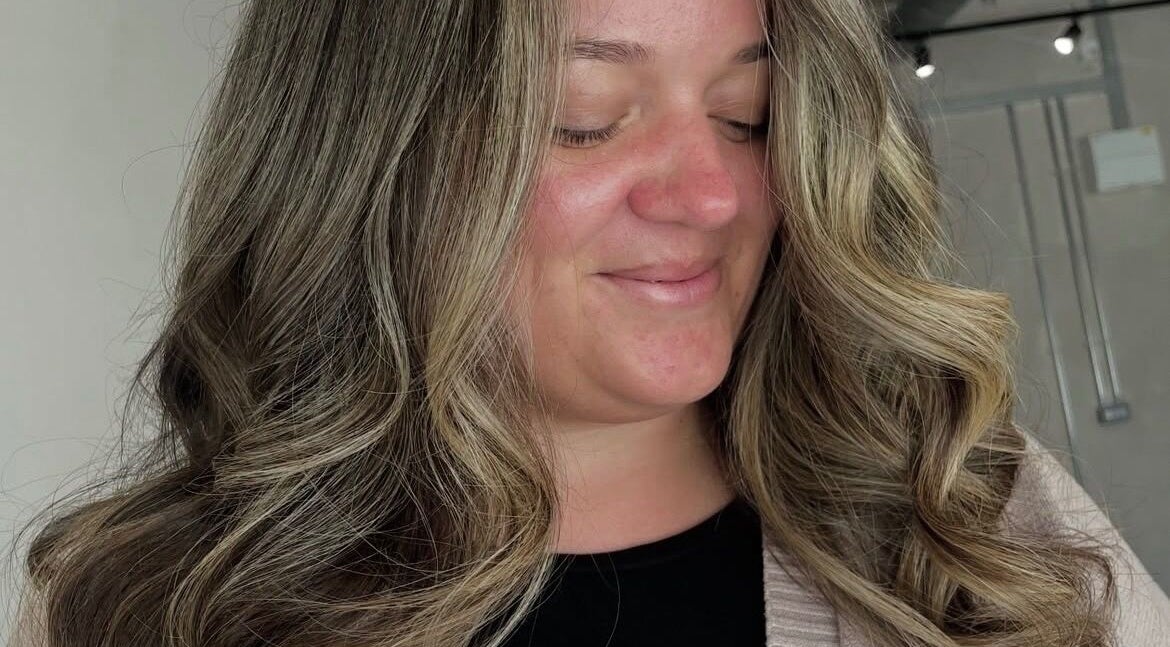 Woman with stylish curls at Chloe Jade Hair, Rogerstone, Newport, GB.