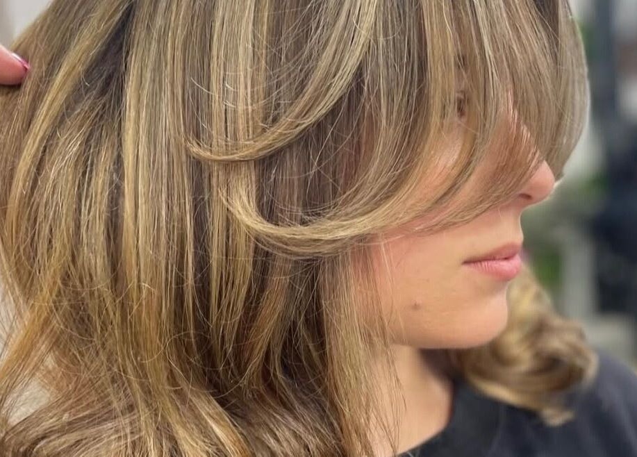 Smooth layered hairstyle at Chloe Jade Hair, Rogerstone, Newport, GB showcasing expert styling.