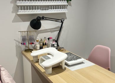 Nail care station at Olivia’s Beauty Studio in Hockley, England, GB, featuring manicure tools and pink chair.
