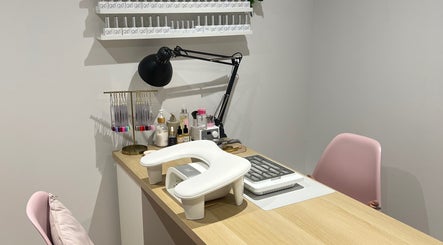 Nail care station at Olivia’s Beauty Studio in Hockley, England, GB, featuring manicure tools and pink chair.