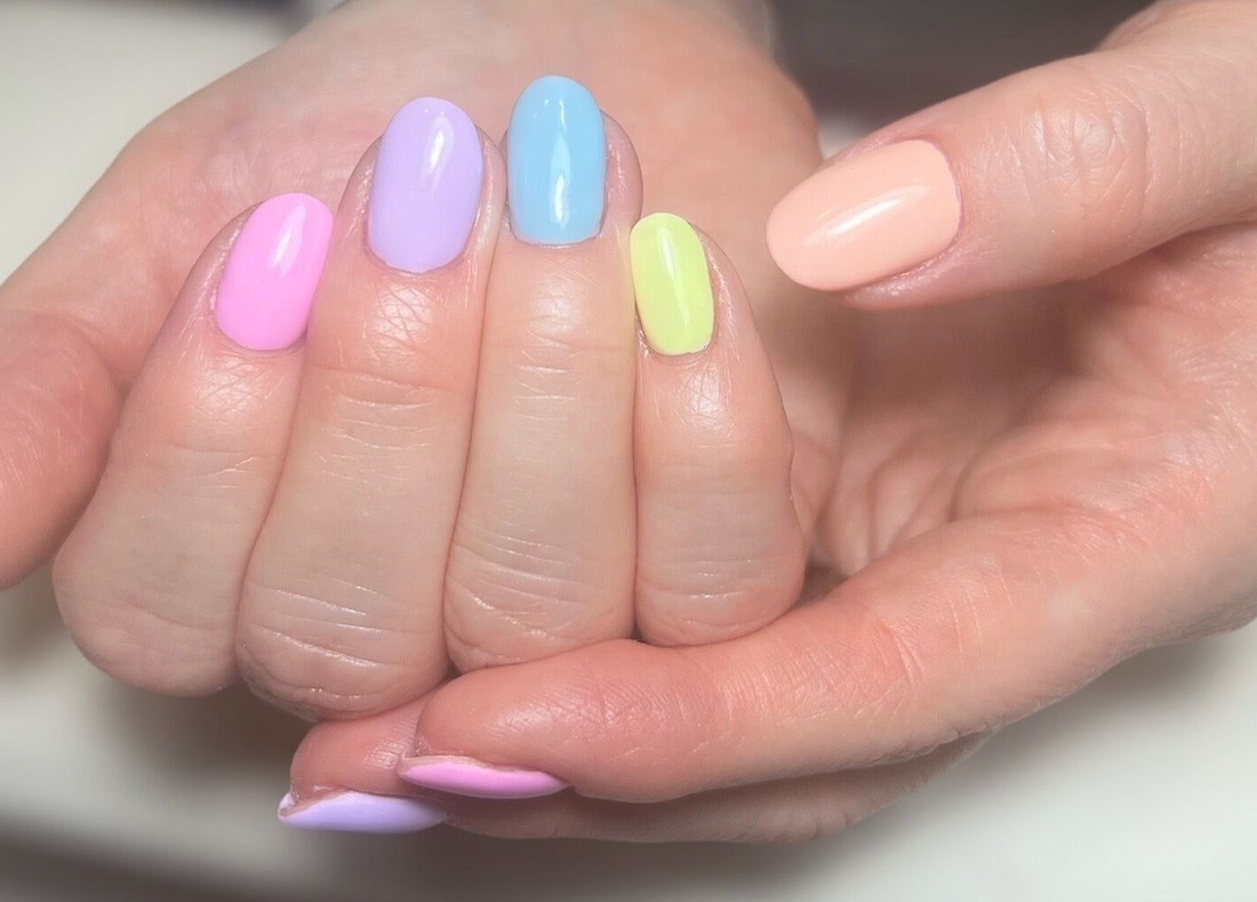 Vibrant pastel nails at Olivia’s Beauty Studio, Hockley, England, GB. Perfect for a stylish manicure.