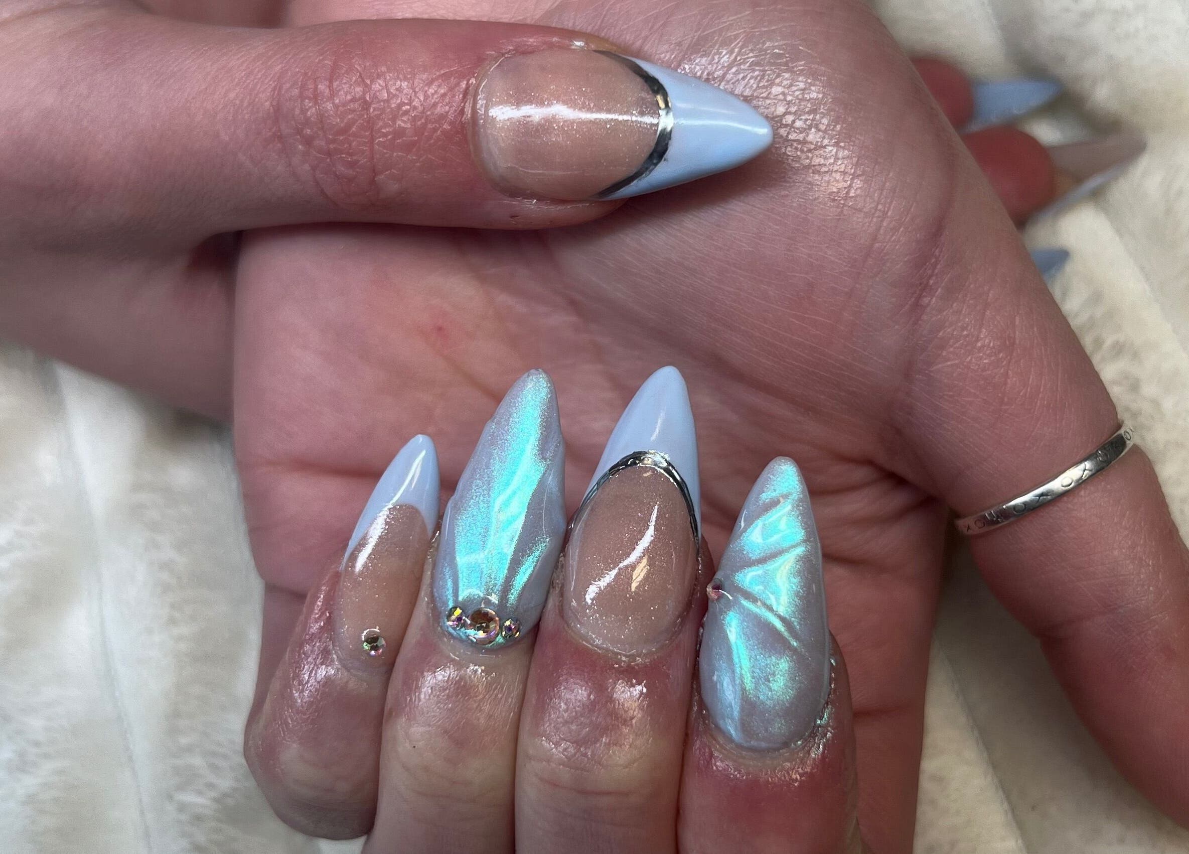 Iridescent blue and nude nails with art at Nails with Love, Red Lake, Ontario, CA.