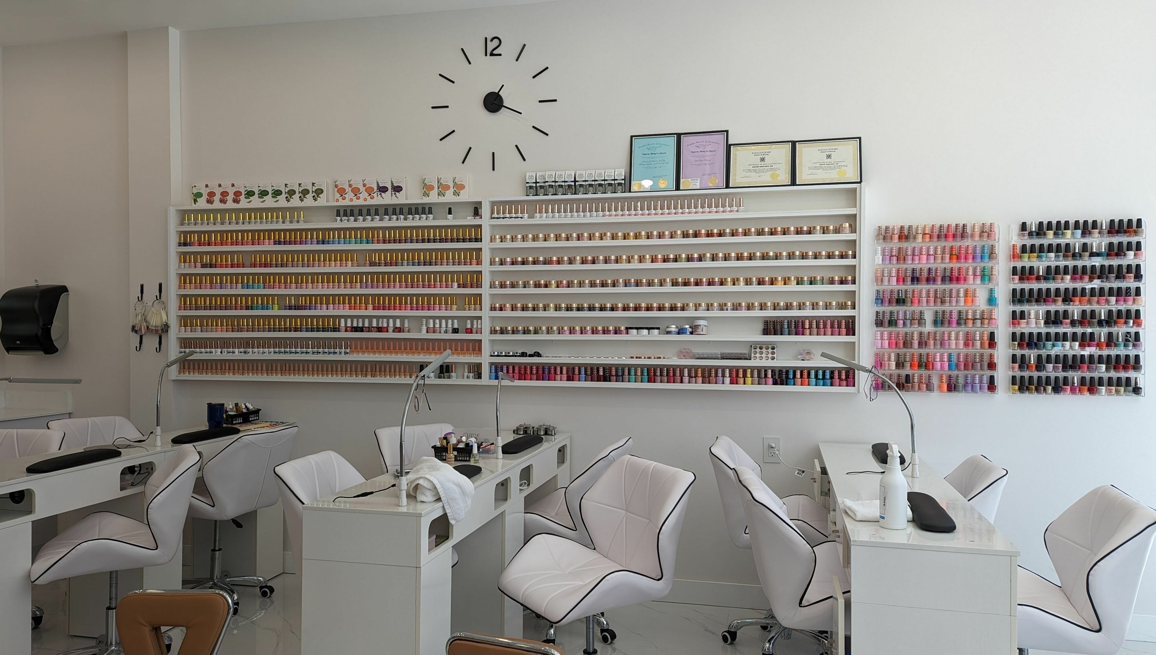 Interior of Sunset Nails in Vancouver, BC, showing nail polish shelves and manicure stations.