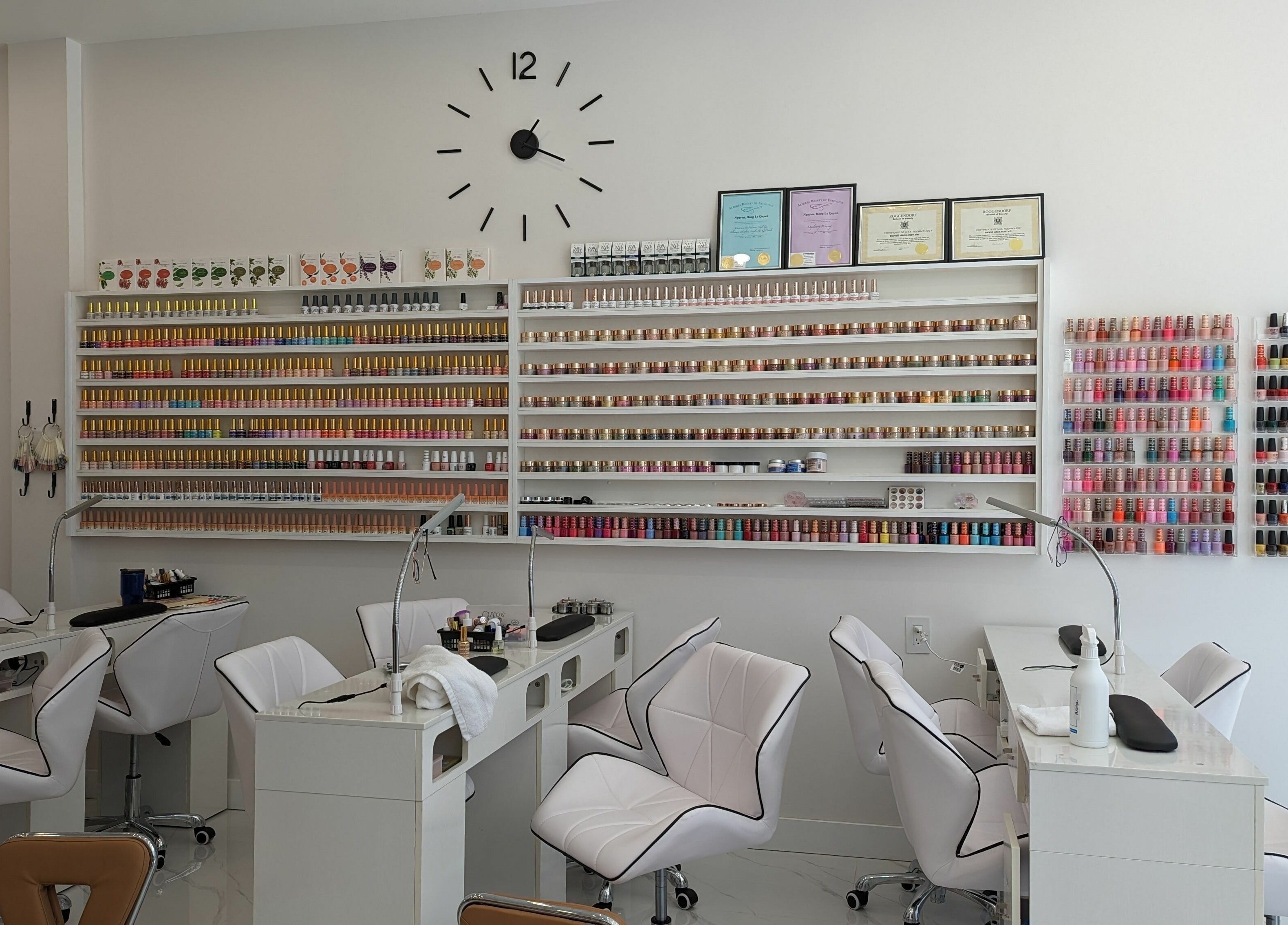 Interior of Sunset Nails in Vancouver, BC, showing nail polish shelves and manicure stations.