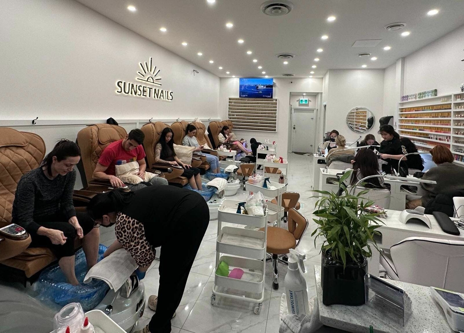 Clients enjoying pedicures at Sunset Nails in Vancouver, British Columbia, CA with cozy, vibrant interiors.