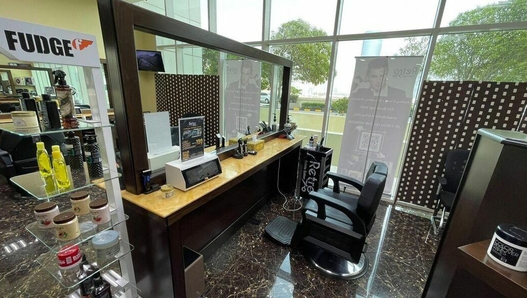 Modern barber chair and styling products at Retro Marina Gents Salon, Abu Dhabi, Abu Dhabi, AE.