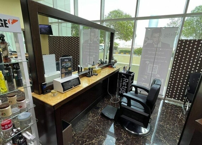 Modern barber chair and styling products at Retro Marina Gents Salon, Abu Dhabi, Abu Dhabi, AE.