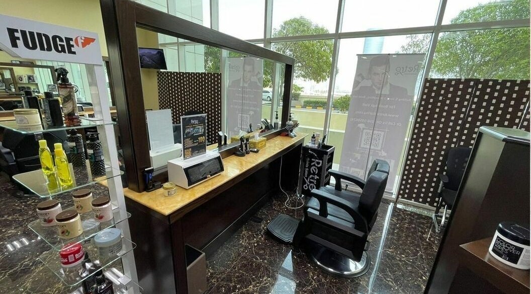Modern barber chair and styling products at Retro Marina Gents Salon, Abu Dhabi, Abu Dhabi, AE.