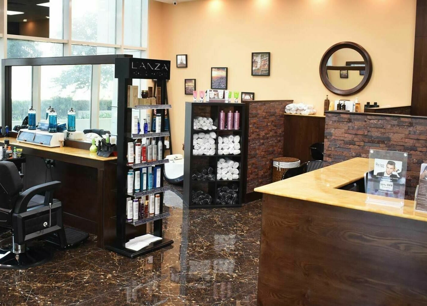 Modern interior of Retro Marina Gents Salon in Abu Dhabi, AE, showcasing sleek barber chairs and product shelves.