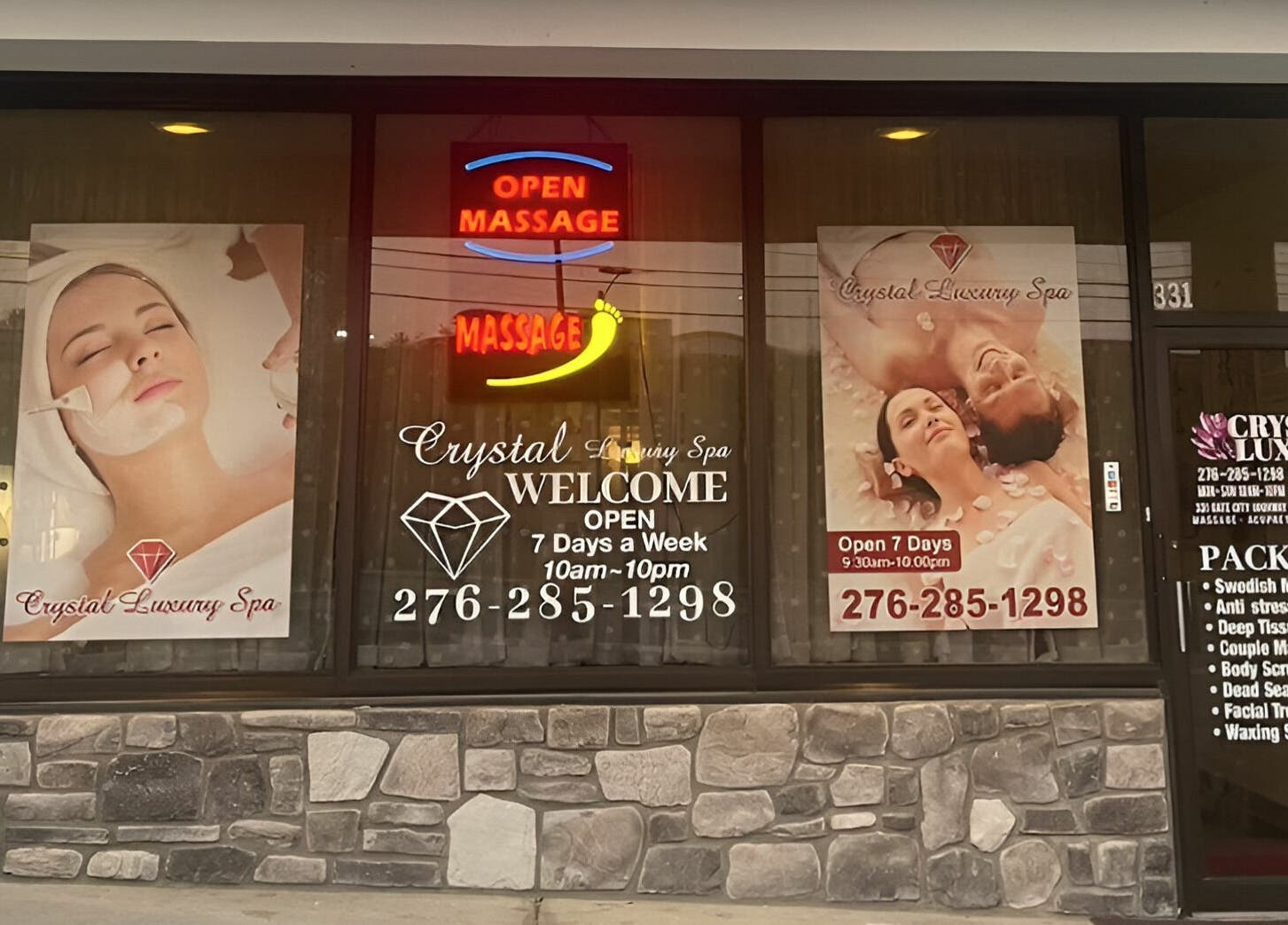 Front view of Crystal Luxury Spa in Bristol, Virginia with window displays promoting massage services.