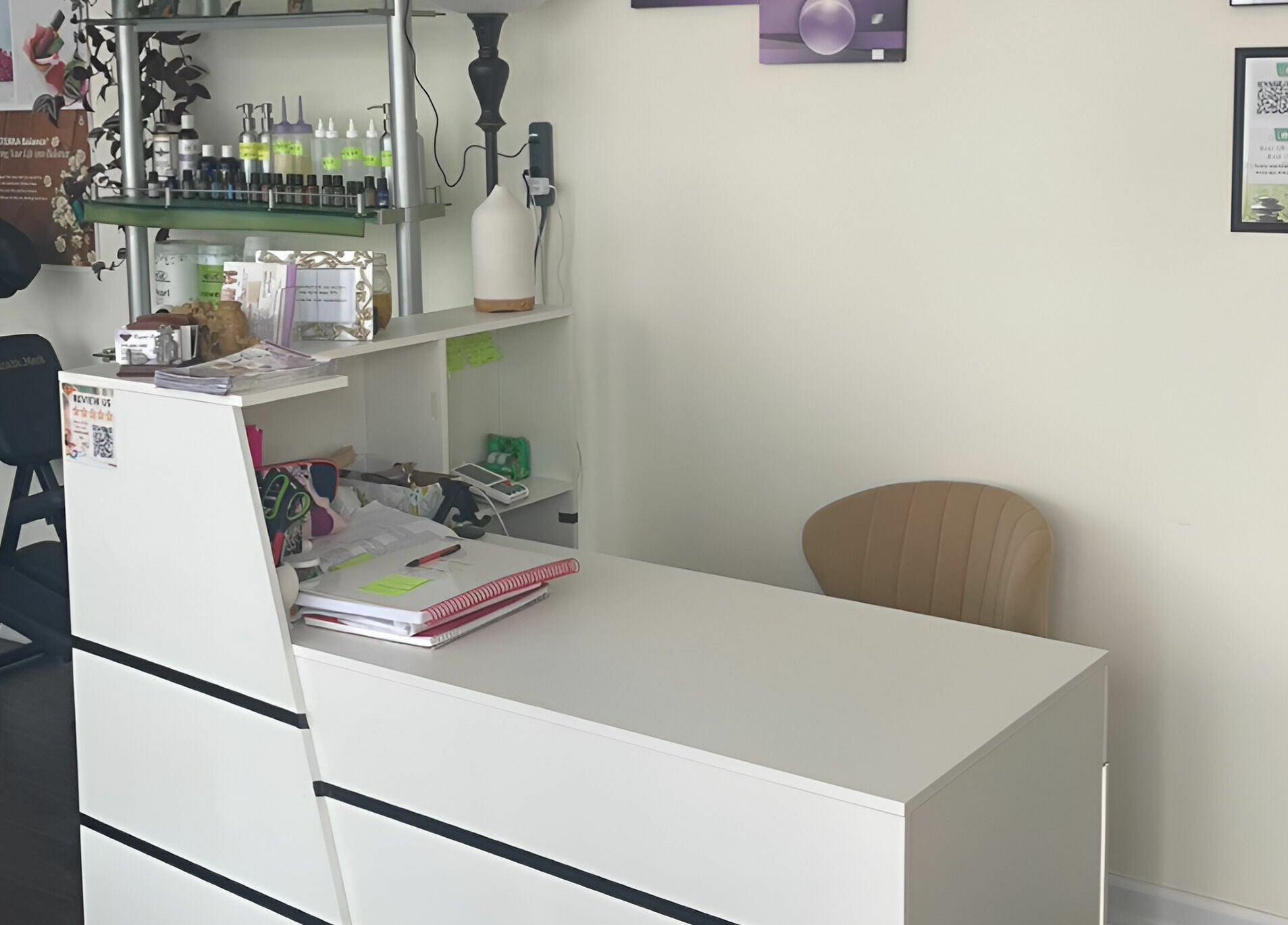 Reception desk at Crystal Luxury Spa, Bristol, Virginia with a relaxing ambiance and massage chair.