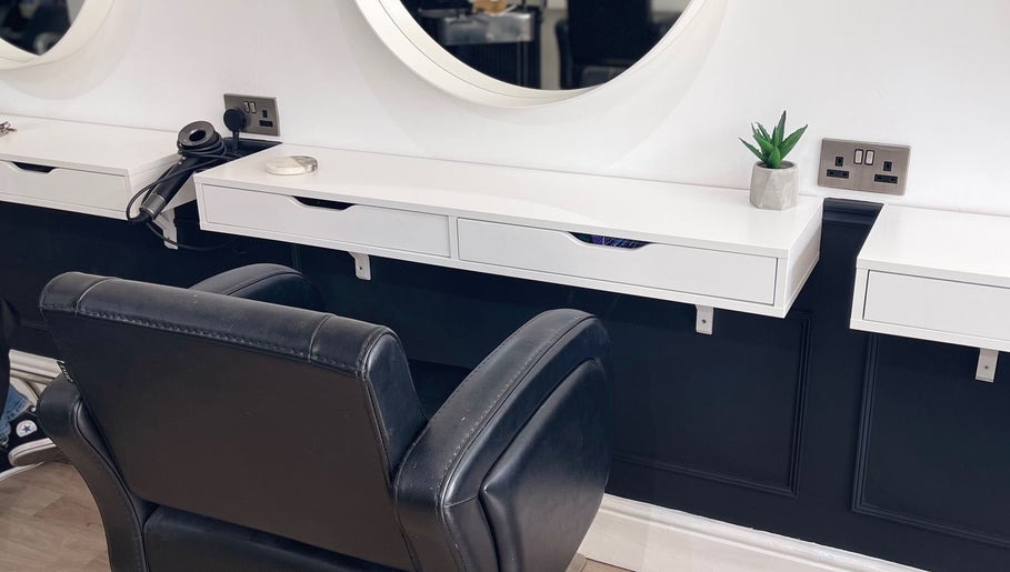 Modern styling station at Hair With Jess in Burton Upon Trent, England, GB, with leather chair and sleek surfaces.