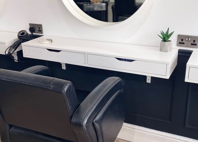 Modern styling station at Hair With Jess in Burton Upon Trent, England, GB, with leather chair and sleek surfaces.