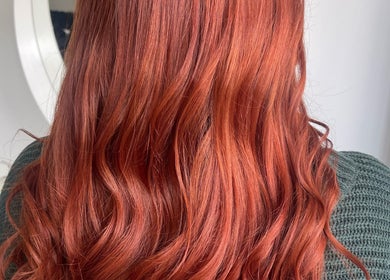 Vibrant red hair styled at Hair With Jess in Burton Upon Trent, England, GB, showcasing elegant waves.