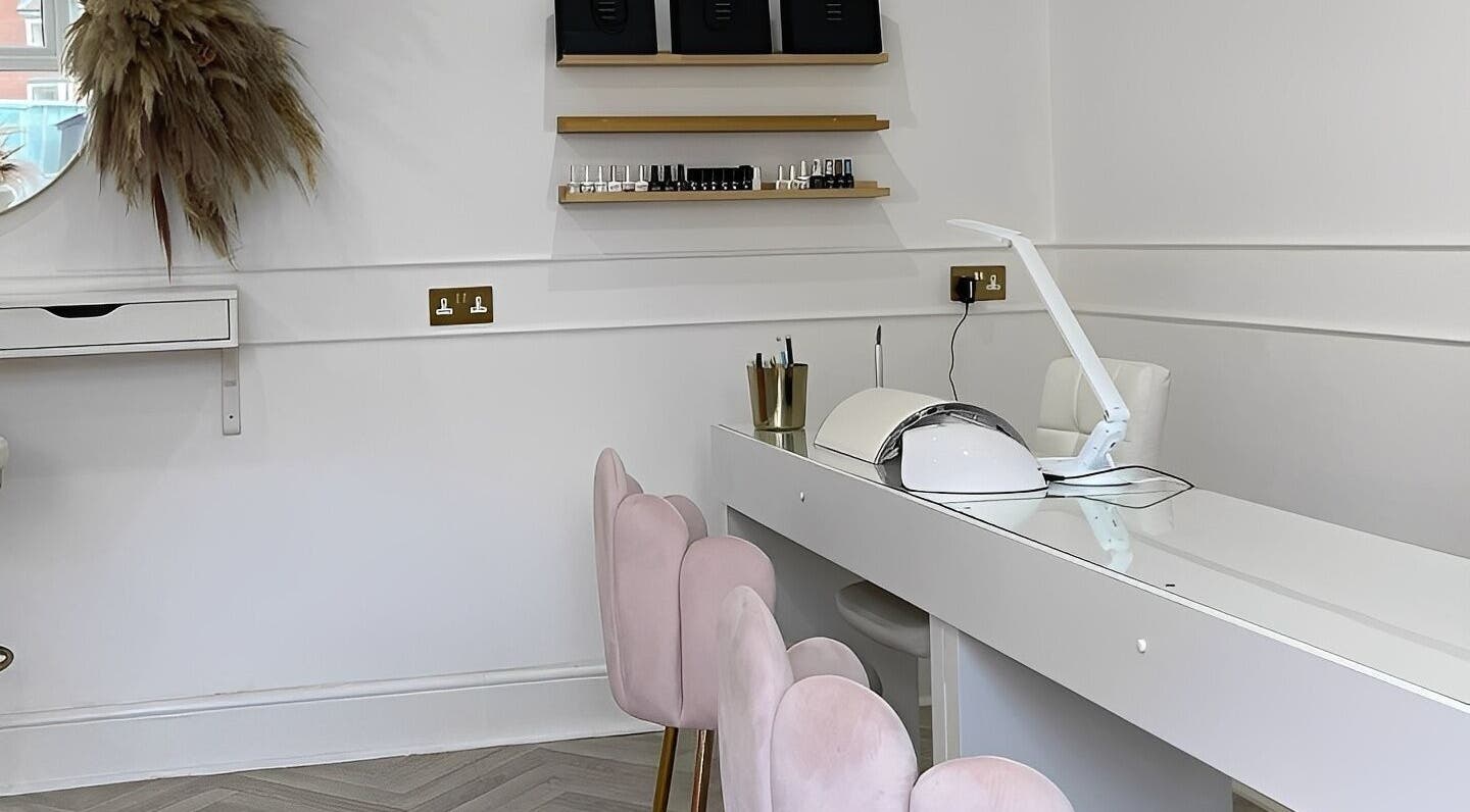Elegant nail studio at Glam Room in Heywood, England, GB with plush seating and nail polish display.