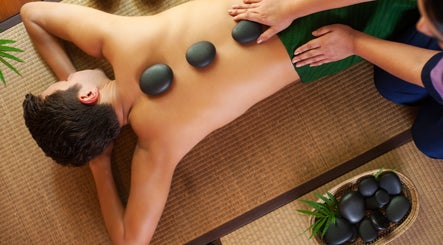 Relaxing hot stone massage at Spring Leaf Spa, North Bethesda, Maryland, US captures tranquility and wellness.