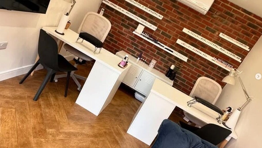 Elegant nail studio interior at Polished Nails, Portsmouth, England, featuring stylish manicure stations.