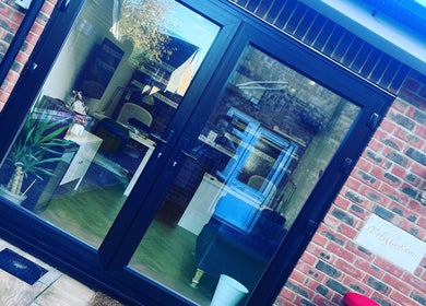Polished Nails entrance with glass doors in Portsmouth, England, GB. Stylish and inviting salon ambiance.