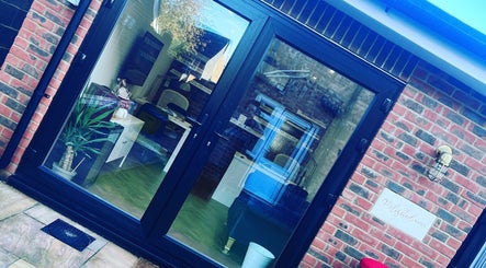 Polished Nails entrance with glass doors in Portsmouth, England, GB. Stylish and inviting salon ambiance.
