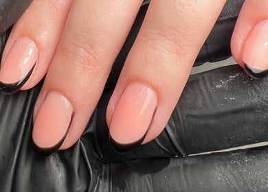 Stylish French manicure with black tips at Polished Nails, Portsmouth, England, GB.