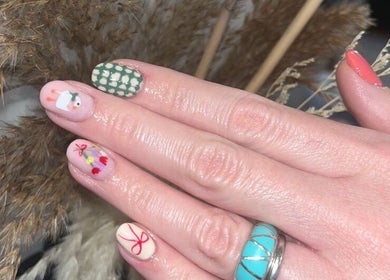 Intricate nail art design at Polished Nails, Portsmouth, England, GB with colorful patterns.