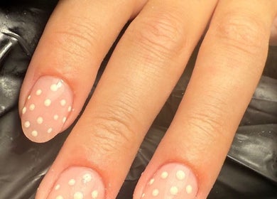 Close-up of polka dot manicure at Polished Nails, Portsmouth, England, GB.