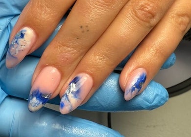 Stylish blue marble nail art at Polished Nails, Portsmouth, England, GB.