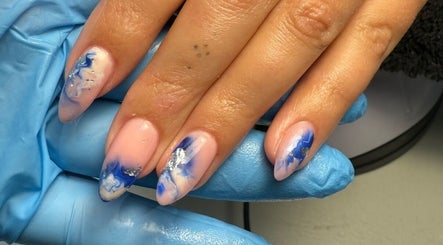Stylish blue marble nail art at Polished Nails, Portsmouth, England, GB.